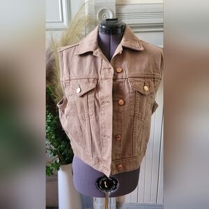Light brown sleeveless denim vest with coper buttons